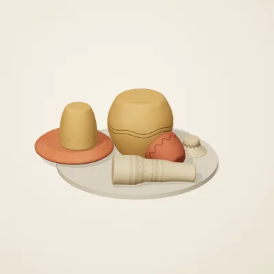 The six parts of Indian Terracotta No. 11 in a loose pile on a round stand