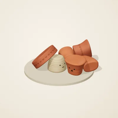 The six parts of Indian Terracotta No. 23 in a loose pile on a round stand