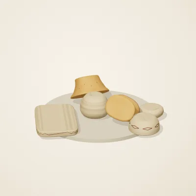 The six parts of Indian Terracotta No. 28 in a loose pile on a round stand