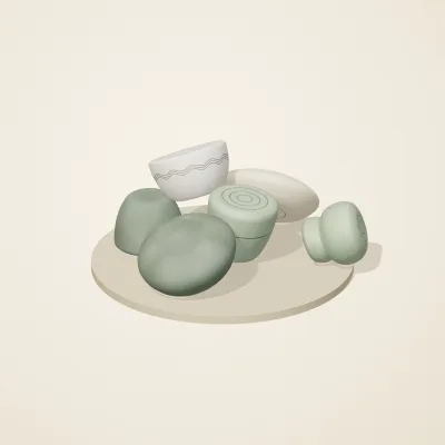The six parts of Thai Celadon No. 1 in a loose pile on a round stand
