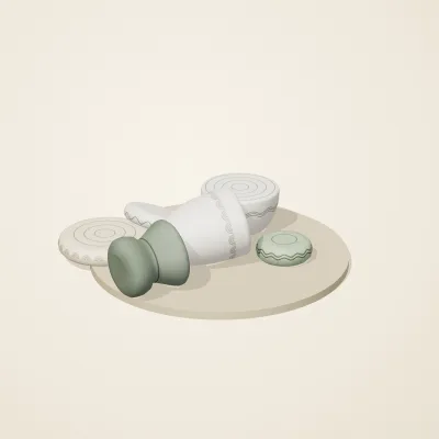 The six parts of Thai Celadon No. 3 in a loose pile on a round stand