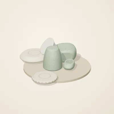 The six parts of Thai Celadon No. 9 in a loose pile on a round stand