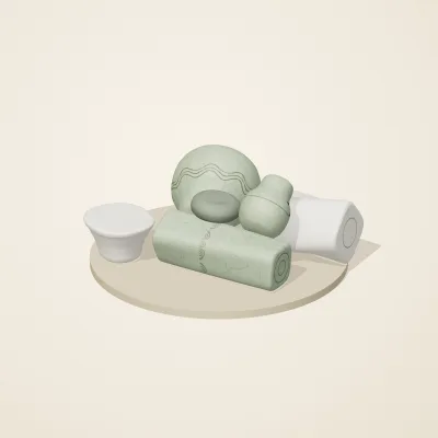 The six parts of Thai Celadon No. 15 in a loose pile on a round stand
