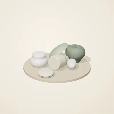 The six parts of Thai Celadon No. 26 in a loose pile on a round stand