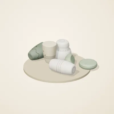 The six parts of Thai Celadon No. 31 in a loose pile on a round stand