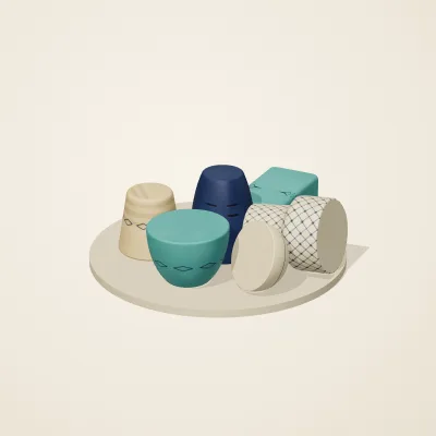 The six parts of Persian Geometry No. 1 in a loose pile on a round stand