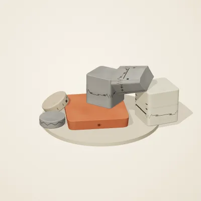 The six parts of Maya Limestone No. 1 in a loose pile on a round stand