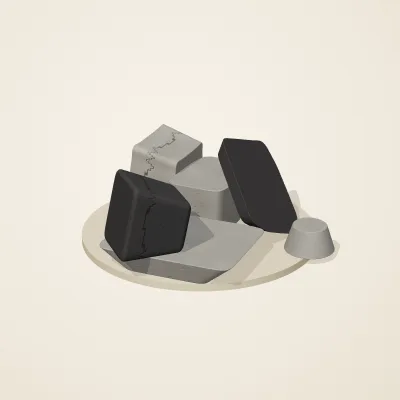 The six parts of Inca Masonry No. 8 in a loose pile on a round stand