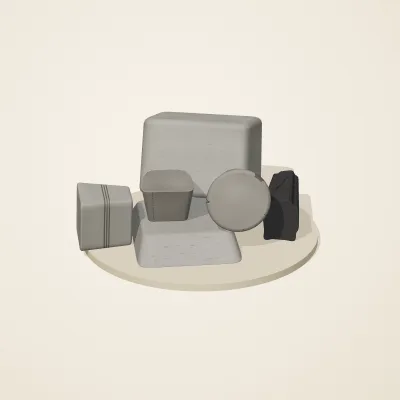 The six parts of Inca Masonry No. 34 in a loose pile on a round stand