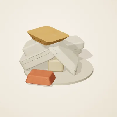 The six parts of Sumerian Clay No. 38 in a loose pile on a round stand