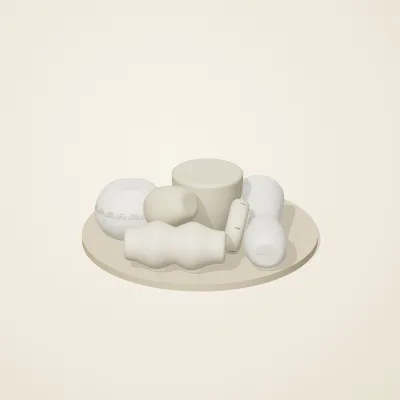 The six parts of Cycladic Forms No. 5 in a loose pile on a round stand