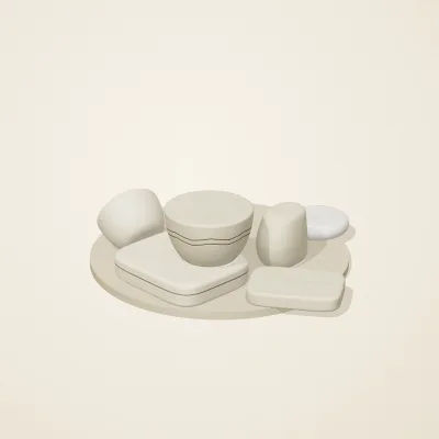 The six parts of Cycladic Forms No. 32 in a loose pile on a round stand