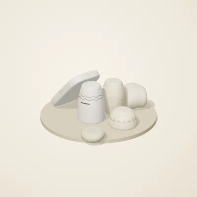 The six parts of Cycladic Forms No. 33 in a loose pile on a round stand