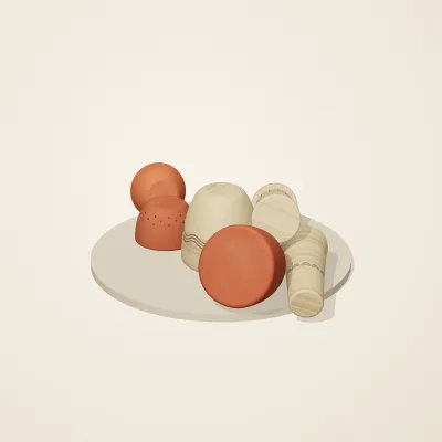 The six parts of Etruscan Terracotta No. 22 in a loose pile on a round stand