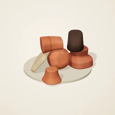The six parts of Etruscan Terracotta No. 37 in a loose pile on a round stand