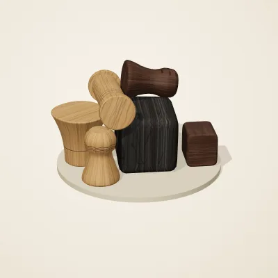 The six parts of Yoruba Woodcraft No. 11 in a loose pile on a round stand