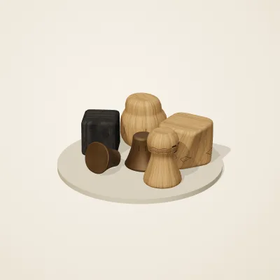 The six parts of Yoruba Woodcraft No. 26 in a loose pile on a round stand