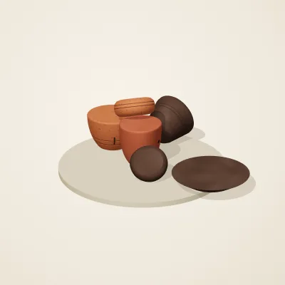 The six parts of Nok Terracotta No. 1 in a loose pile on a round stand