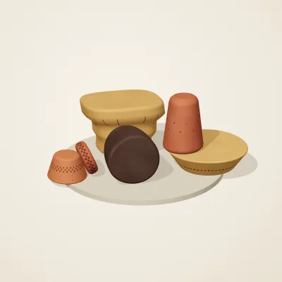 The six parts of Nok Terracotta No. 2 in a loose pile on a round stand