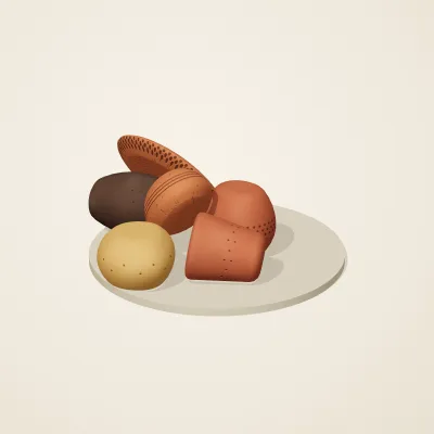 The six parts of Nok Terracotta No. 23 in a loose pile on a round stand