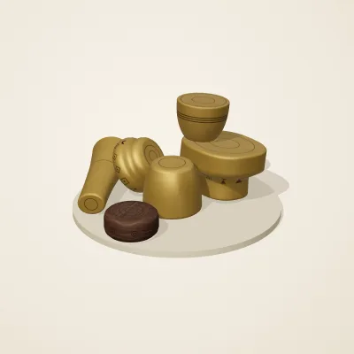 The six parts of Ashanti Goldwork No. 11 in a loose pile on a round stand