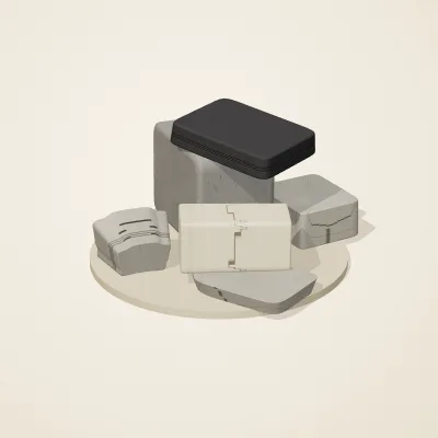 The six parts of Great Zimbabwe Stone No. 5 in a loose pile on a round stand