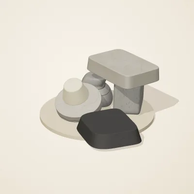 The six parts of Great Zimbabwe Stone No. 10 in a loose pile on a round stand