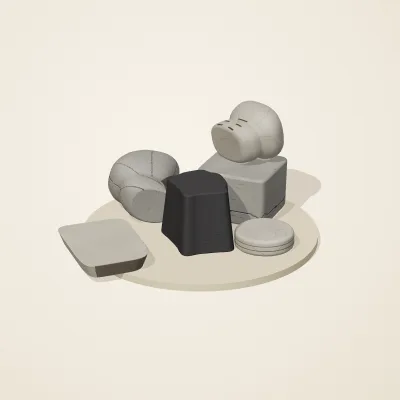 The six parts of Great Zimbabwe Stone No. 14 in a loose pile on a round stand
