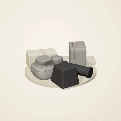 The six parts of Great Zimbabwe Stone No. 20 in a loose pile on a round stand