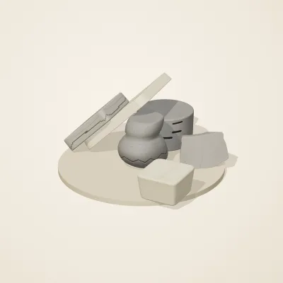 The six parts of Great Zimbabwe Stone No. 36 in a loose pile on a round stand