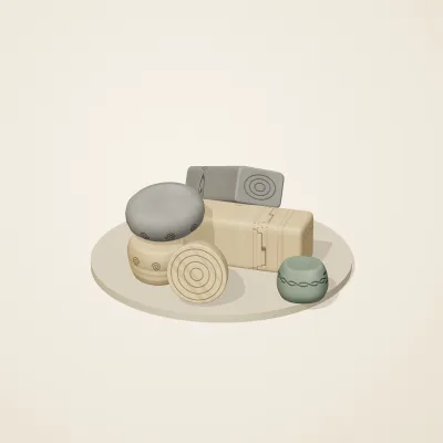 The six parts of Celtic Stonework No. 35 in a loose pile on a round stand