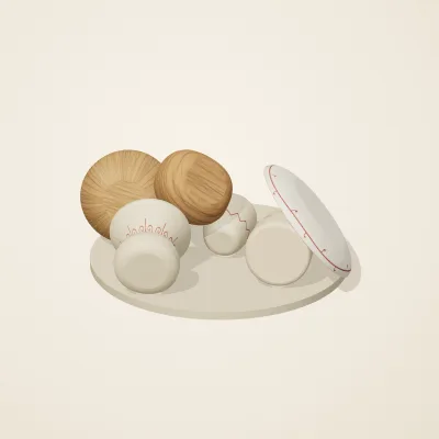 The six parts of Slavic Folk Toys No. 19 in a loose pile on a round stand