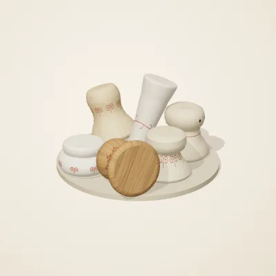 The six parts of Slavic Folk Toys No. 22 in a loose pile on a round stand
