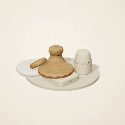 The six parts of Slavic Folk Toys No. 39 in a loose pile on a round stand