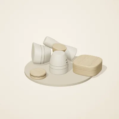 The six parts of Alpine Woodcraft No. 20 in a loose pile on a round stand
