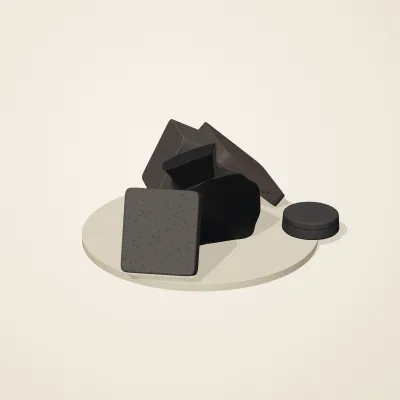 The six parts of Obsidian Temple No. 16 in a loose pile on a round stand