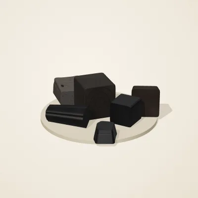 The six parts of Obsidian Temple No. 35 in a loose pile on a round stand