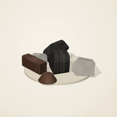 The six parts of Ashen Relics No. 2 in a loose pile on a round stand