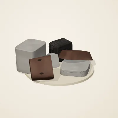 The six parts of Ashen Relics No. 12 in a loose pile on a round stand