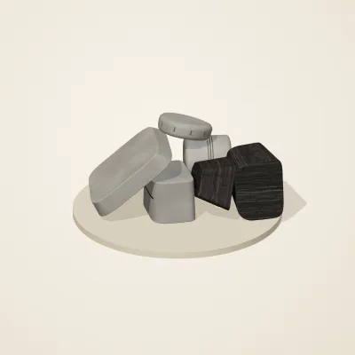The six parts of Ashen Relics No. 13 in a loose pile on a round stand