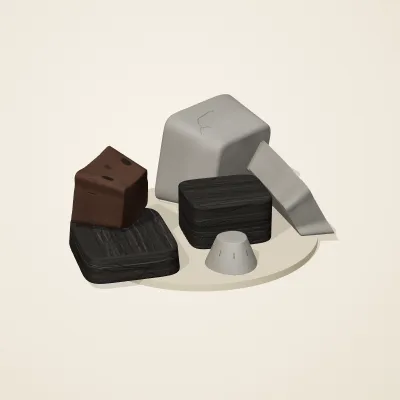 The six parts of Ashen Relics No. 14 in a loose pile on a round stand