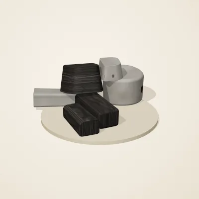 The six parts of Ashen Relics No. 17 in a loose pile on a round stand