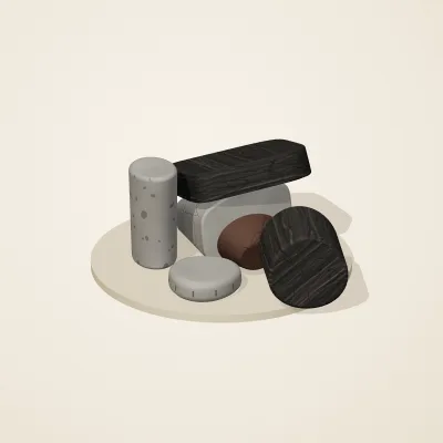 The six parts of Ashen Relics No. 19 in a loose pile on a round stand