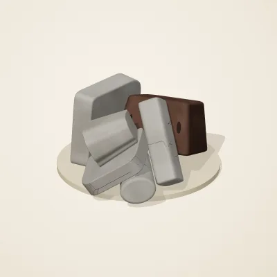 The six parts of Ashen Relics No. 22 in a loose pile on a round stand