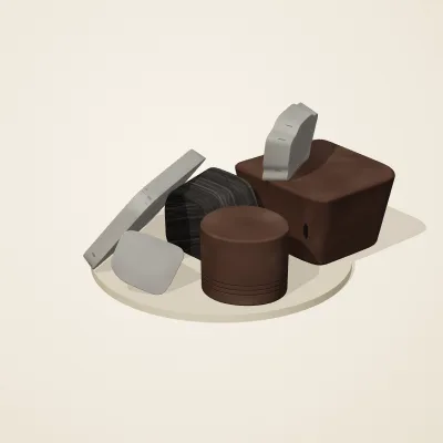 The six parts of Ashen Relics No. 25 in a loose pile on a round stand
