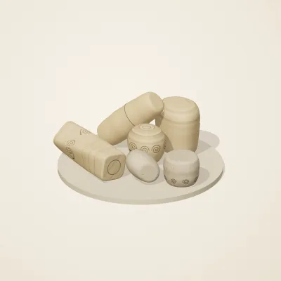 The six parts of Fossil Garden No. 28 in a loose pile on a round stand