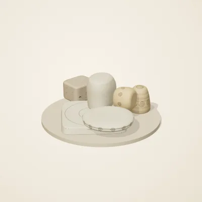 The six parts of Fossil Garden No. 33 in a loose pile on a round stand