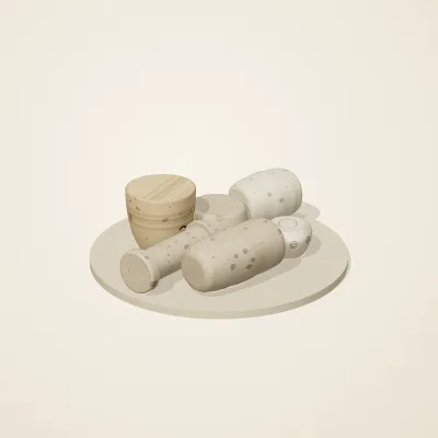 The six parts of Fossil Garden No. 37 in a loose pile on a round stand