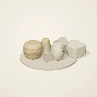 The six parts of Fossil Garden No. 38 in a loose pile on a round stand