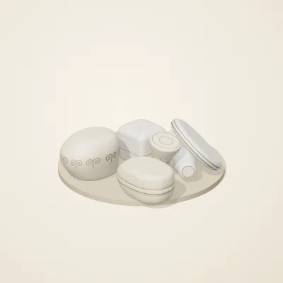 The six parts of Ivory Moon No. 2 in a loose pile on a round stand